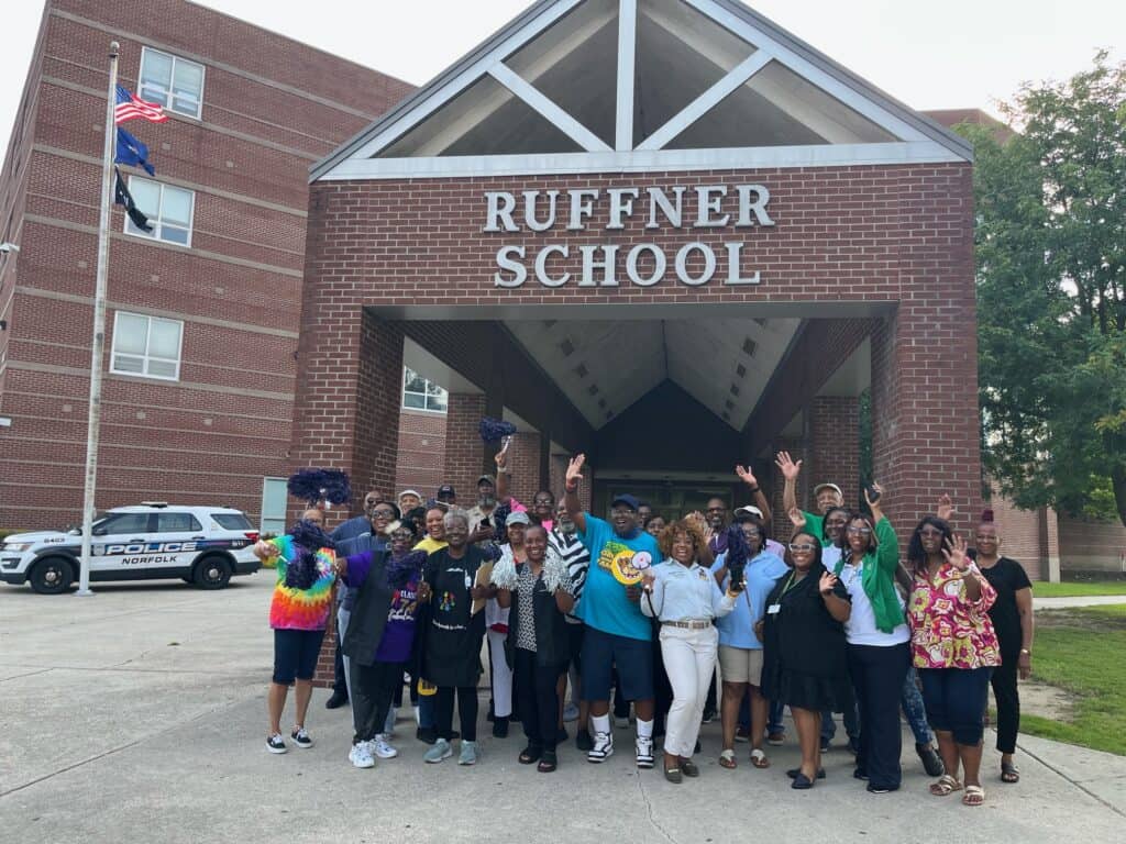 Students, school staff, and community members gathered outside Ruffner Academy in Norfolk, Virginia